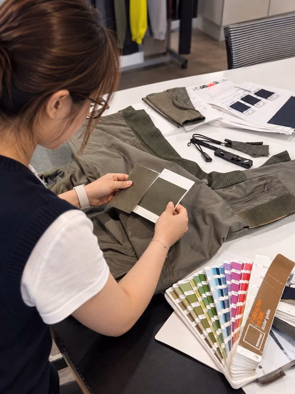 Functional apparel materials and components being confirmed against an approved garment reference at Varytex